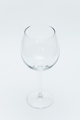 Empty wine glass on a white background.