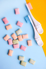 Toothbrushes and pads of multi-colored chewing gum