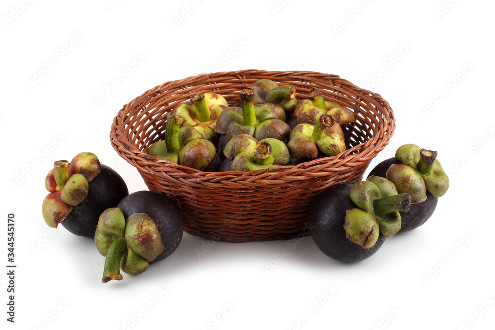 Wall mural Mangosteen fruits on wicker plate