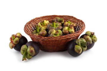 Mangosteen fruits on wicker plate