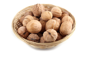 Walnuts on wicker plate