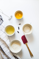 Preparation of savoiardi biscuits , step by steps visual recipe, ingredients are layered over a gray background
