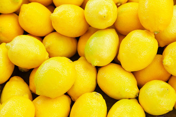 Colorful Display Of Lemons at fruit and vegetables street Market, organic ecological food from local producers