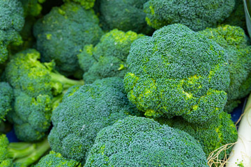 heap of broccoli on fruit vegetables street market, organic ecological food from local producers farmers, background