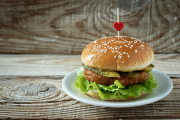vegetarian Burger on a wooden background on a plate