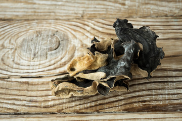 Dry Chinese black muer mushroom on a wooden background