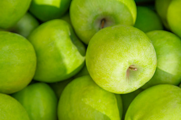 Background of green apples at the local street market. Green apple Raw fruit, healthy ecological organic fresh produce
