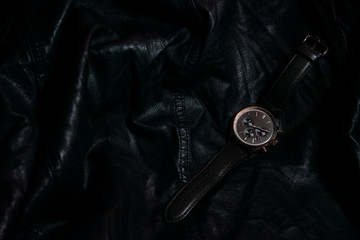 Gold LEATHER WATCH, VINTAGE STYLE WRIST WATCH, MEN'S LEATHER WATCH on leather background blur.