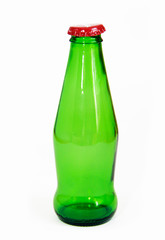 green glass bottle with iron lid on white background