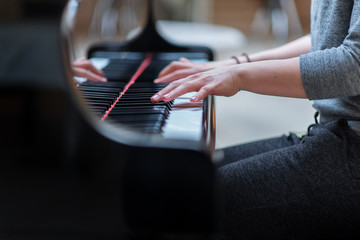 young musician plays the piano