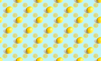 Seamless geometric pattern, sectional lemon and whole citrus on a gentle blue background. Pattern