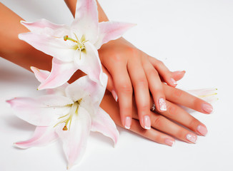 manicure pedicure with flower lily closeup isolated on white background perfect shape hands spa salon