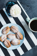 Madeleine cookies with nuts and icing sugar - 344559380