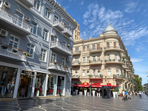 Baku, Azerbaijan, September, 09 2019. People walking near historical buildings on the pedestrian street Nizami in autumn on a Sunny day. Houses-77 and 79. Azerbaijan, Baku city