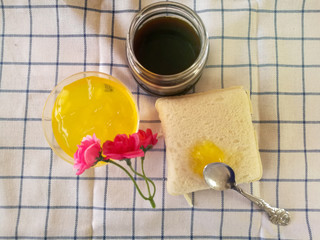 table set with coffee white bread  and orange juice