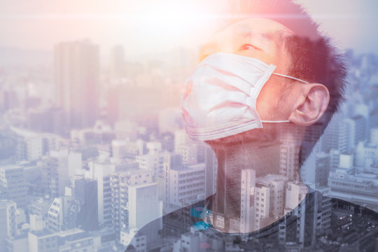 Healthy Asian Handsome Male wearing face mask overlay city metro background for prevent virus air pollution concept