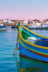 Colorful traditional boats in Marsaxlokk, Malta © Seticio