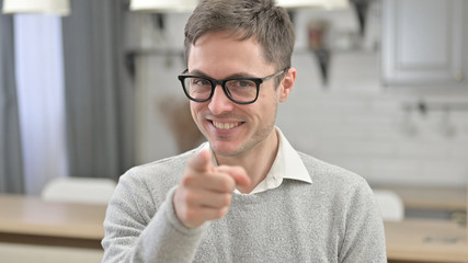 Portrait of Young Man Pointing at the Camera