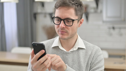 Portrait of Young Man using Smartphone