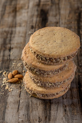 cornstarch alfajor with dulce de leche and homemade coconut in squares on wood