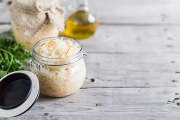 Sauerkraut fermented salad. Homemade fresh pickled cabbage (german sauerkraut) with ingredients in jar