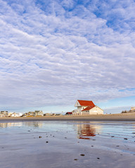 red roof building on the beach