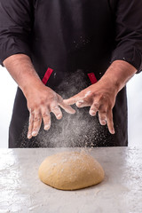 Cooking dough by chef hands for homemade pastry bread, pizza, pasta recipe preparation on table background