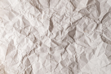 Crumpled white paper background.