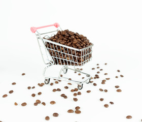 Coffee beans inside small shopping cart on white background