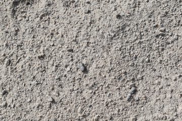 Heller Sand, kleine Korngröße mit größeren Körnern, grobkörnig