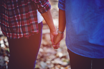 Lovers holding hands Two lovers holding hands to give each other warm love on the day of love Family day