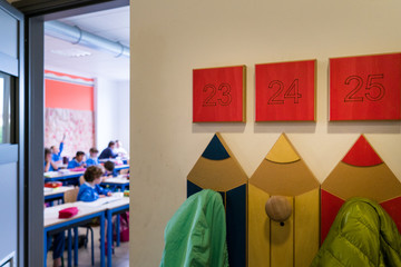 School corridor with hanging clothes for children in the classroom