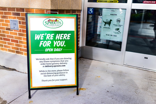 Herndon, USA - April 27, 2020: Sprouts Farmers Market sign for grocery store entrance for social distancing delivery during coronavirus Covid-19 epidemic