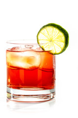 red drink with ice cubes and lemon on white background, isolated