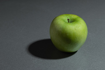 still life ripe fresh green granny apple on a gray background