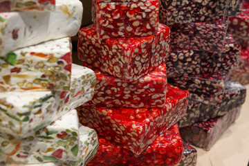 Turkish sweets with nuts on the counter in the store
