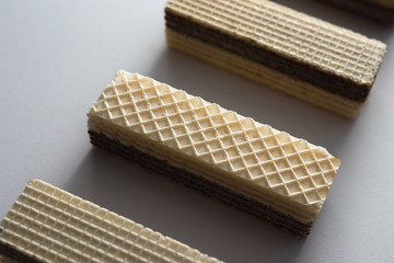 crispy waffle with cream and chocolate filling on a white background