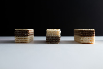 crispy waffle with cream and chocolate filling on a white background