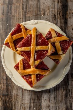 homemade quince frola pasta in squares on wood