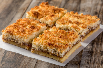 homemade cookies with coconut on wooden table