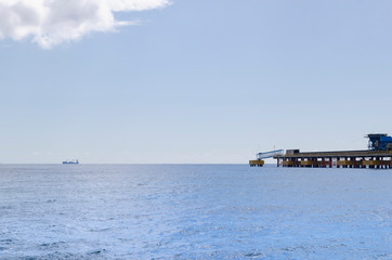 cargo ships arriving at the port of Haina in Santo Domingo, view of the beach