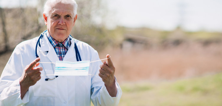 Senior wearing surgical mask to prevent Coronavirus