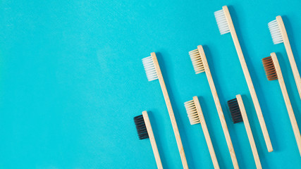 Wooden toothbrushes on a blue background. zero waste concept. dental care without platysik.