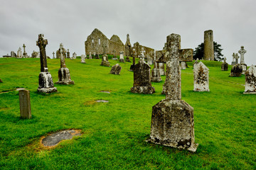 The cemetery in the medieval monastery of Clonmacnoise, Ireland, during a rainy summer day.