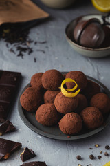 Close-up of chocolate truffles with black pepper and lemon zest