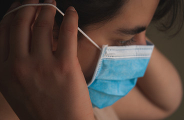 Person putting on a mask