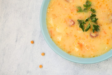 Delicious pea soup with smoked sausage. 