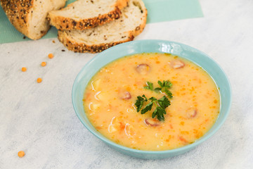 Delicious pea soup with smoked sausage. 