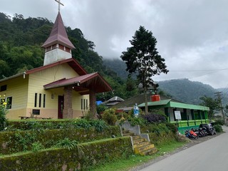 A house that is parked on the side of a building