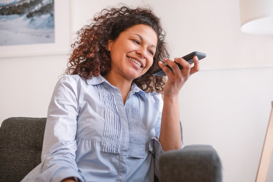 Portrait Of Black Woman Talking To Phone Virtual Assistant